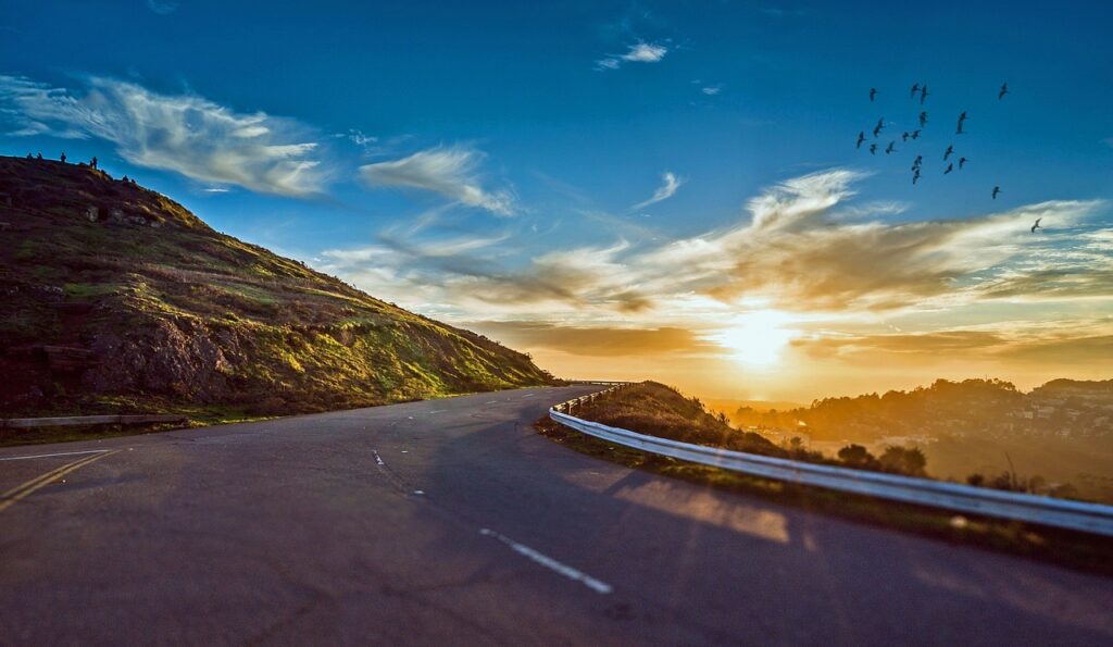 winding road, sunset, mountains-1556177.jpg